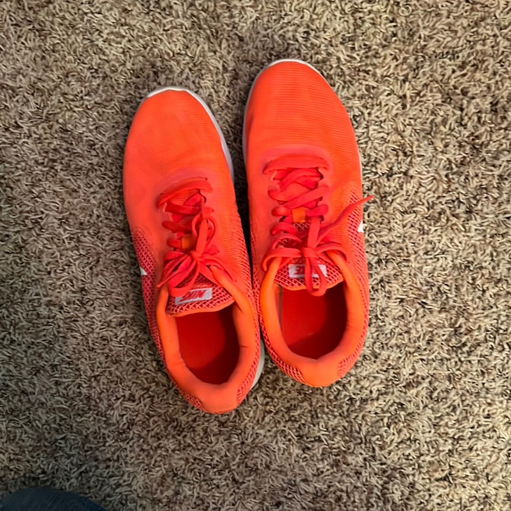 Bright orange nike sneakers